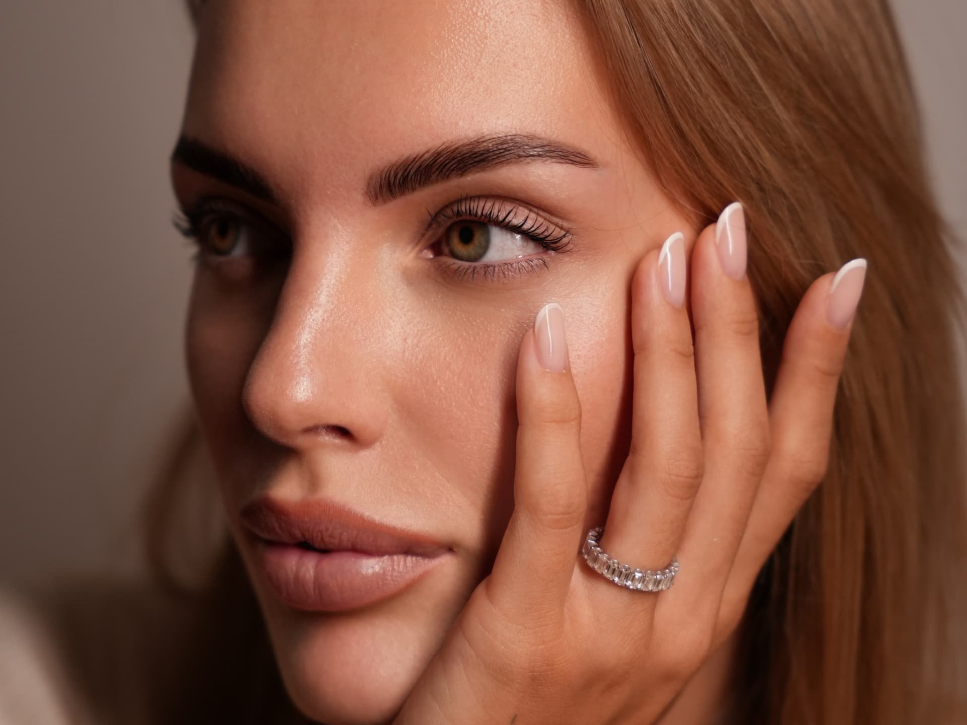 Defined brows and lifted lashes in a close portrait
